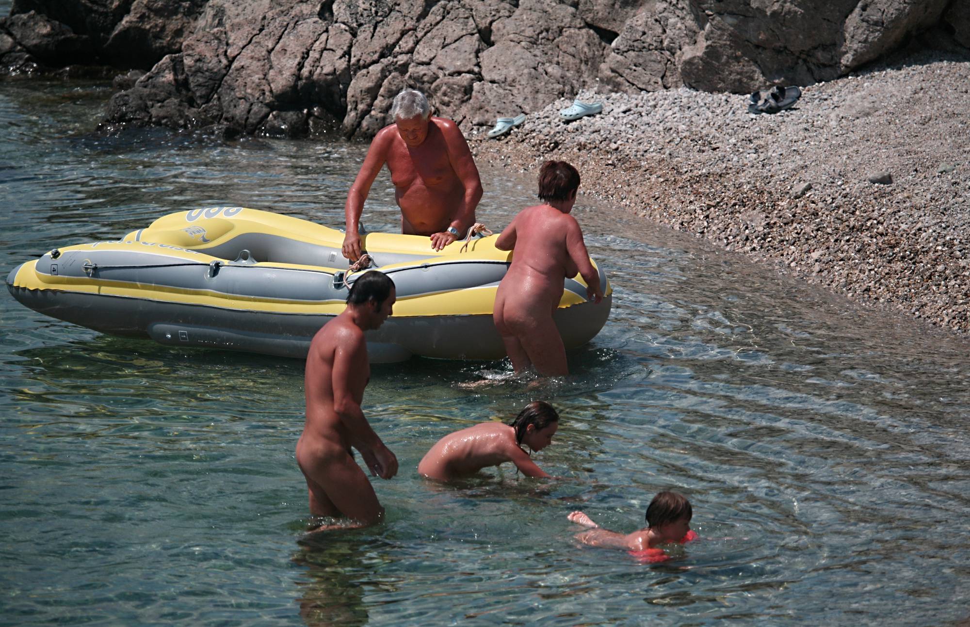 Purenudism Pics Lone Nudist in Yellow Boat - 2
